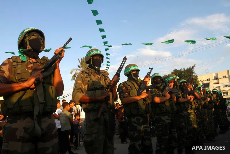 Hamas militants take part in a celebration of the recent release of hundreds of Palestinians by Israel in the central Gaza Strip, Friday, Oct. 28, 2011. Hundreds of Palestinians were released in exchange for captured Isr...