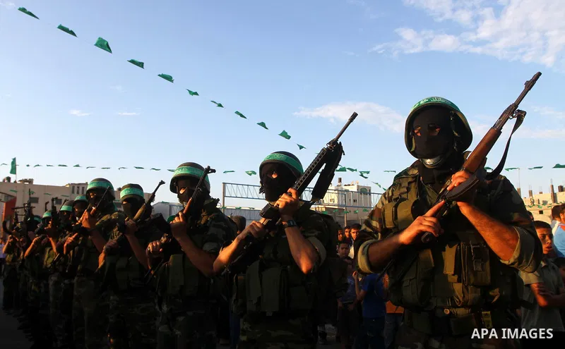Hamas militants take part in a celebration of the recent release of hundreds of Palestinians by Israel in the central Gaza Strip, Friday, Oct. 28, 2011. Hundreds of Palestinians were released in exchange for captured Isr...
