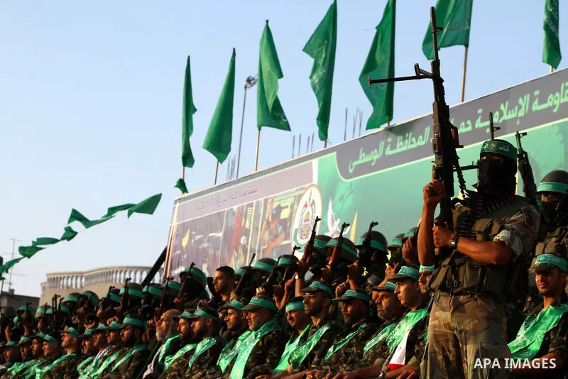 Freed Palestinian prisoners attend a celebration of the recent release of hundreds of Palestinians by Israel in the central Gaza Strip, Friday, Oct. 28, 2011. Hundreds of Palestinians were released in exchange for captur...