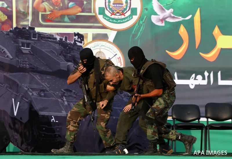 Hamas militants take part in a celebration of the recent release of hundreds of Palestinians by Israel in the central Gaza Strip, Friday, Oct. 28, 2011. Hundreds of Palestinians were released in exchange for captured Isr...