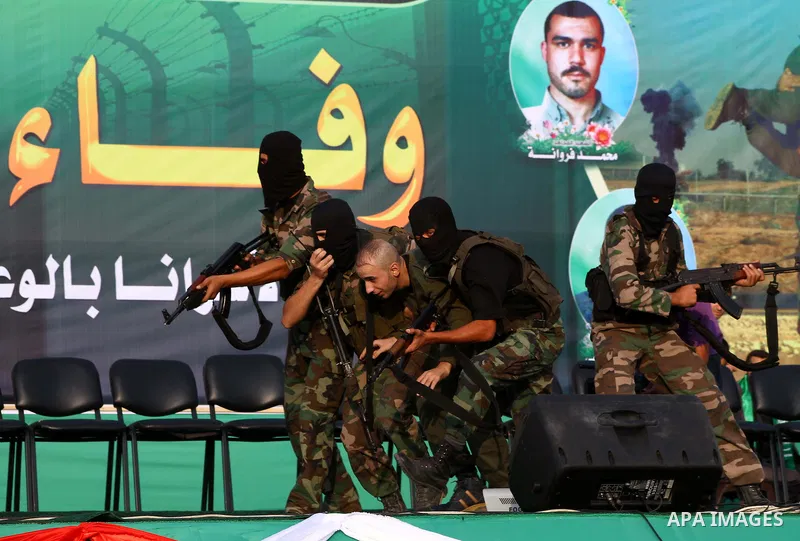 Hamas militants take part in a celebration of the recent release of hundreds of Palestinians by Israel in the central Gaza Strip, Friday, Oct. 28, 2011. Hundreds of Palestinians were released in exchange for captured Isr...