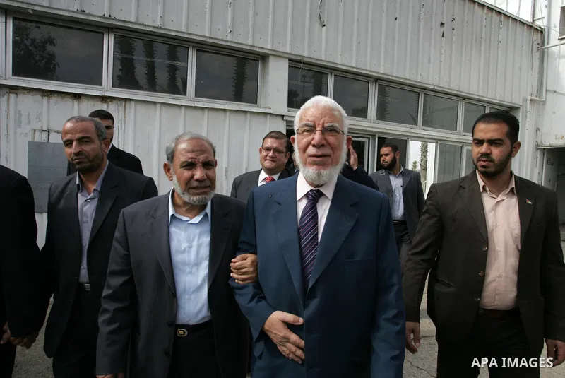 Jumaa Amen, deputy leader of the Muslim Brotherhood in Egypt (R) speak with Hamas leader Mahmud El-Zahar(L) in Rafah crossing, southern Gaza Strip, Saturday, Oct. 29, 2011. Photo by Abed Rahim Khatib