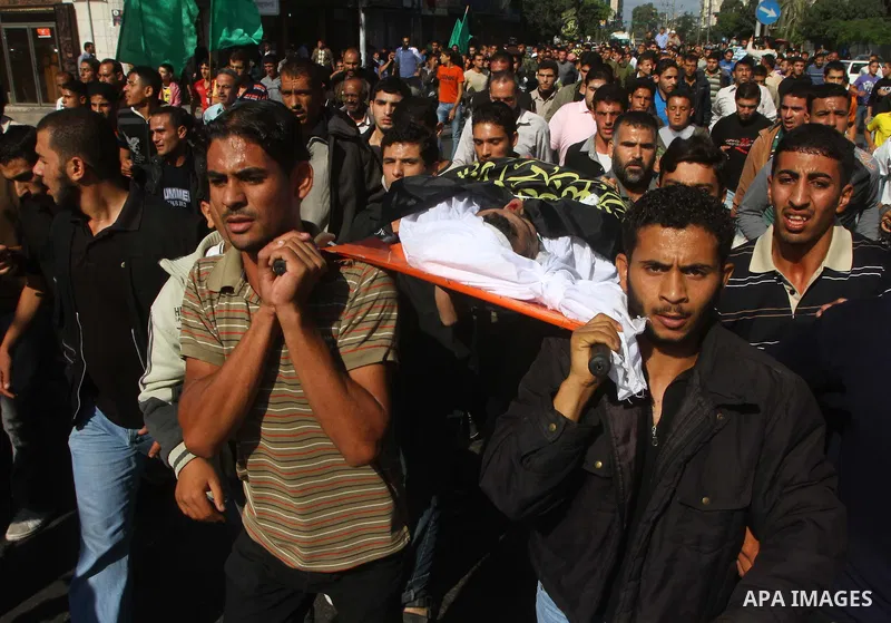 Palestinian mourners take part in the funerals of militants of the Islamic Jihad movement in Gaza City on Oct. 30, 2011, killed during Israeli air raids late last night. The Islamic Jihad said it would observe an Egyptia...