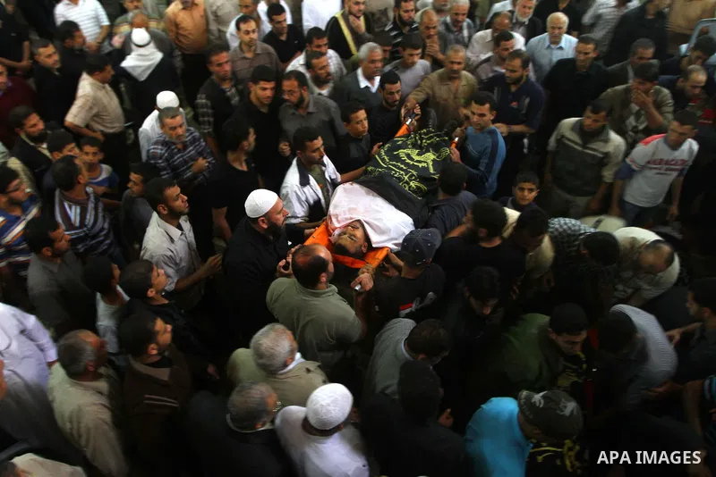 Palestinian mourners take part in the funerals of militants of the Islamic Jihad movement in Gaza City on Oct. 30, 2011, killed during Israeli air raids late last night. The Islamic Jihad said it would observe an Egyptia...