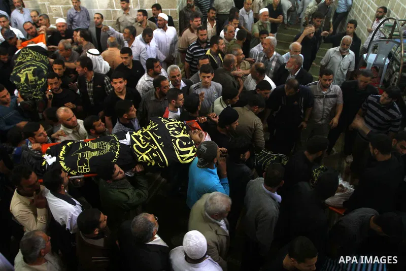 Palestinian mourners take part in the funerals of militants of the Islamic Jihad movement in Gaza City on Oct. 30, 2011, killed during Israeli air raids late last night. The Islamic Jihad said it would observe an Egyptia...
