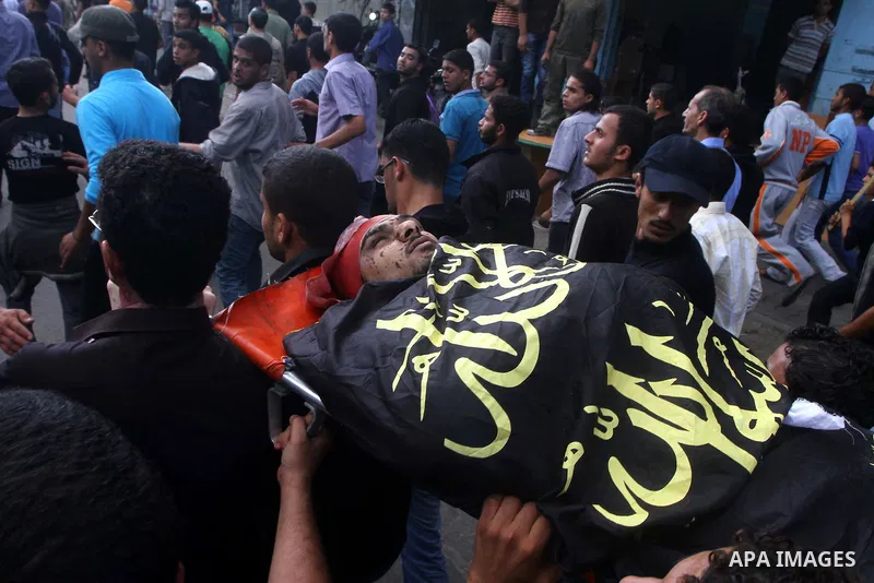 Palestinian mourners take part in the funerals of militants of the Islamic Jihad movement in Gaza City on Oct. 30, 2011, killed during Israeli air raids late last night. The Islamic Jihad said it would observe an Egyptia...