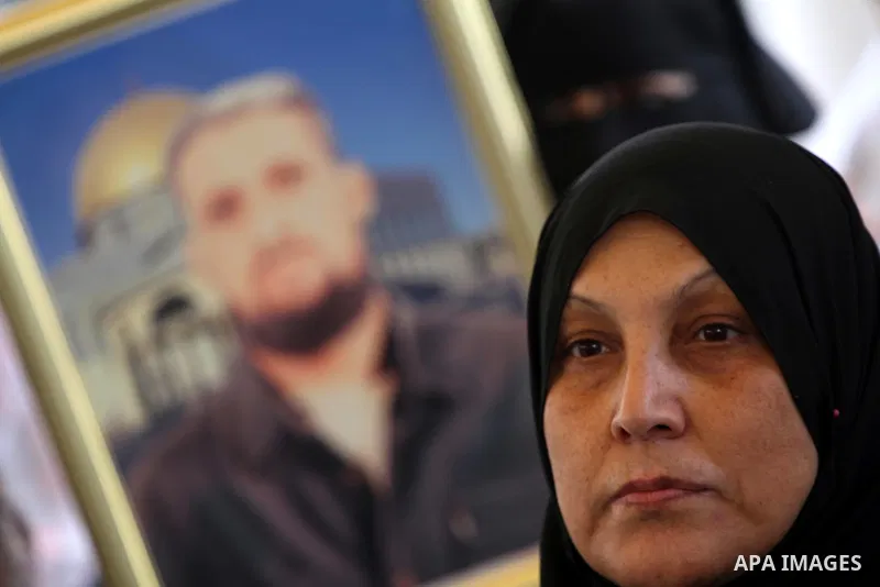 Palestinians gather during a protest at the Red Cross' offices in Gaza City to call for the release of Palestinian prisoners held in Israeli jails, on Oct. 31, 2011. An Egyptian-brokered truce appeared to be taking hold...
