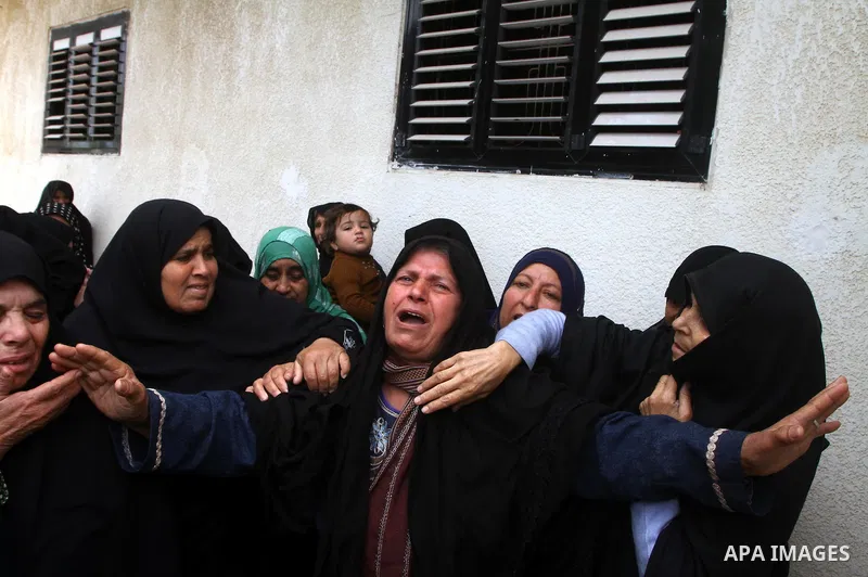 Palestinian women react during the funeral of DFLP militant Ahmed Jargon, killed in an Israeli strike on Sunday, in Rafah, southern Gaza Strip, Monday, Oct. 31, 2011. Deadly violence between Israel and Gaza militants fla...