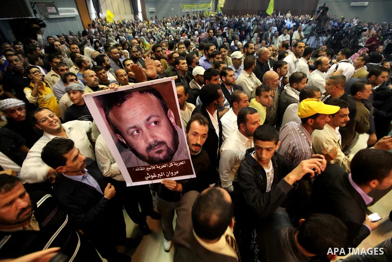Fatah Movement supporters celebrate the release of hundreds of prisoners following a swap with captured Israeli soldier Gilad Shalit at al-Shawwa theatre, in Gaza city on Nov. 2,2011. Photo by Ashraf Amra