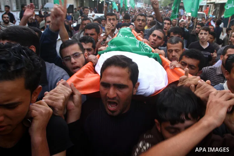 Palestinians mourn the bodies of two militants killed by Israeli troops, in the northern Gaza Strip November 3, 2011. Israeli forces killed the two Palestinian militants in a clash along the Israel-Gaza border on Thursda...