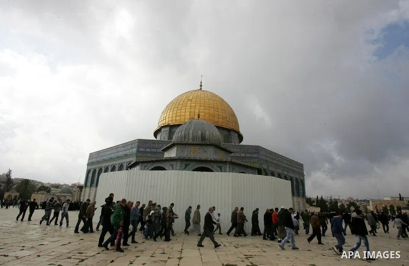 Palestinians walk in front of the Dome of the Rock after Friday prayers at Al-Aqsa mosque compound in Jerusalem's old city on Nov. 4,2011, ahead of the Muslim Eid al-Adha festival at the end of the week. Muslims across t...
