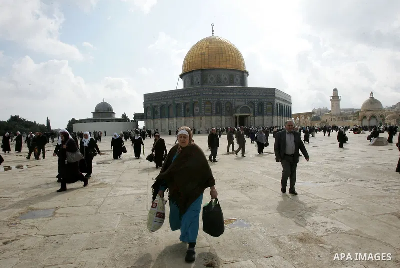 Palestinians walk in front of the Dome of the Rock after Friday prayers at Al-Aqsa mosque compound in Jerusalem's old city on Nov. 4,2011, ahead of the Muslim Eid al-Adha festival at the end of the week. Muslims across t...