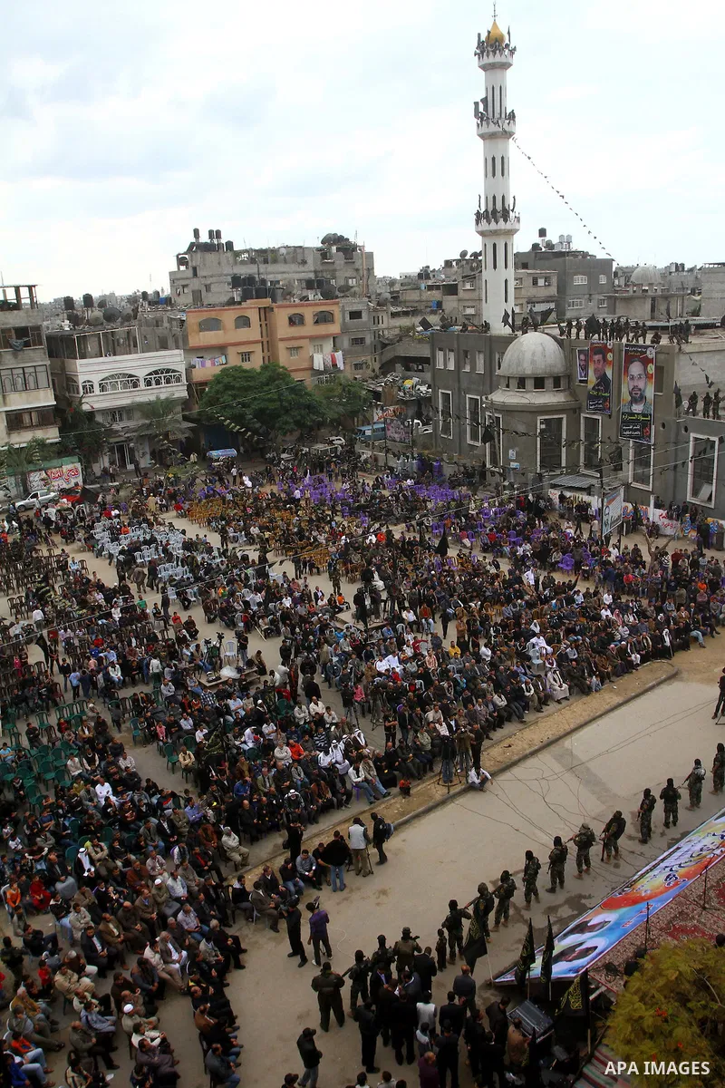 Palestinian Islamic Jihad militants and supporters take part in a rally marking the 16th anniversary of the killing of Fathi al-Shiqaqi, the militant movement's founder, in the northern Gaza Strip November 4, 2011. The m...