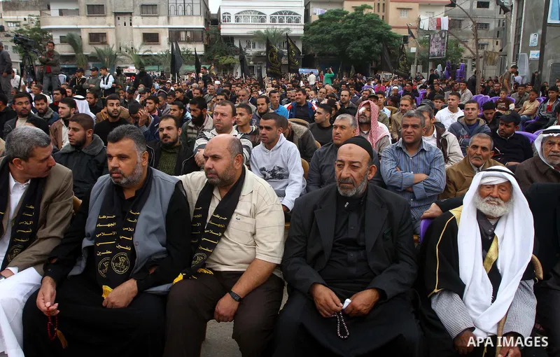 Palestinian Islamic Jihad militants and supporters take part in a rally marking the 16th anniversary of the killing of Fathi al-Shiqaqi, the militant movement's founder, in the northern Gaza Strip November 4, 2011. The m...