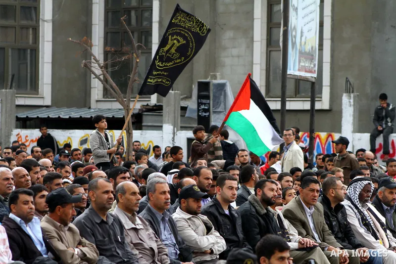 Palestinian Islamic Jihad militants and supporters take part in a rally marking the 16th anniversary of the killing of Fathi al-Shiqaqi, the militant movement's founder, in the northern Gaza Strip November 4, 2011. The m...