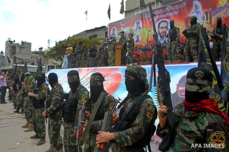 Palestinian Islamic Jihad militants and supporters take part in a rally marking the 16th anniversary of the killing of Fathi al-Shiqaqi, the militant movement's founder, in the northern Gaza Strip November 4, 2011. The m...