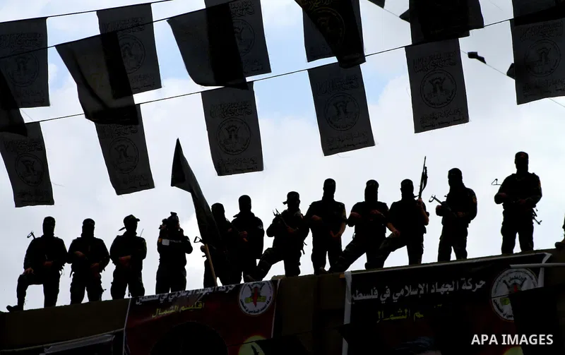 Palestinian Islamic Jihad militants and supporters take part in a rally marking the 16th anniversary of the killing of Fathi al-Shiqaqi, the militant movement's founder, in the northern Gaza Strip November 4, 2011. The m...