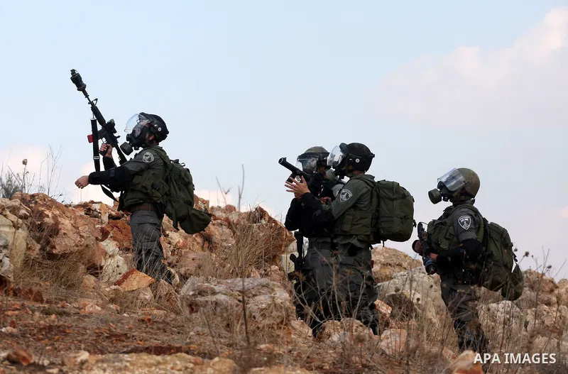 Israeli soldiers clash with Palestinian stone throwers following a weekly demonstration against Israeli settlement expansion, in the West Bank village of Nabi Saleh on November 4, 2011 in the Israeli occupied Palestinian...