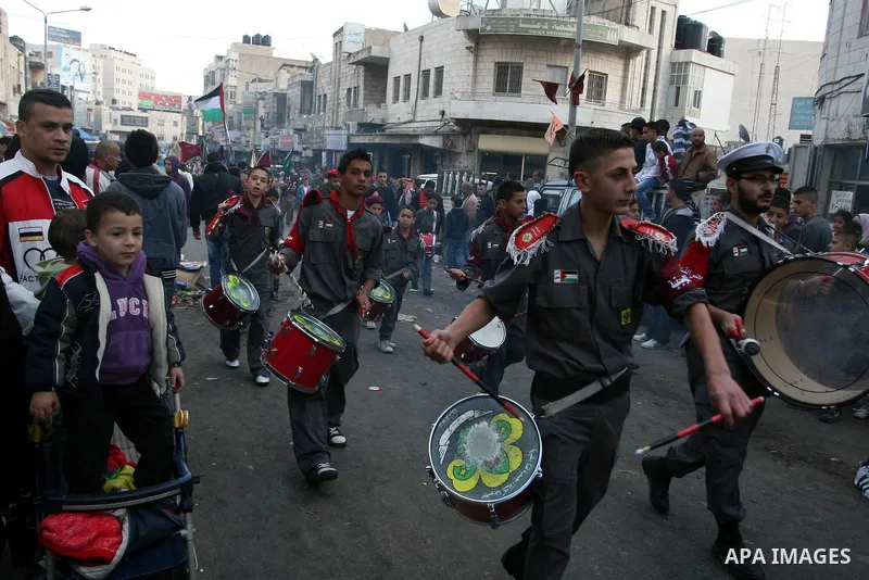 Palestinians shopping to celebrate Eid al-Adha festival in a market of Gaza City on Nov. 4, 2011. Muslims across the world are preparing to celebrate the annual festival of Eid al-Adha, or the Festival of Sacrifice. Phot...