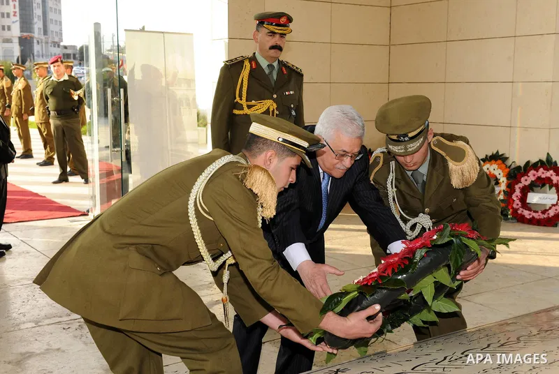 Palestinian President Mahmoud Abbas lays a wreath on the tomb of Yasser Arafat, PLO chairman and former Palestinian president, in the West Bank town of Ramallah on 6,2011 marking the Eid al-Adha holiday, celebrated at th...