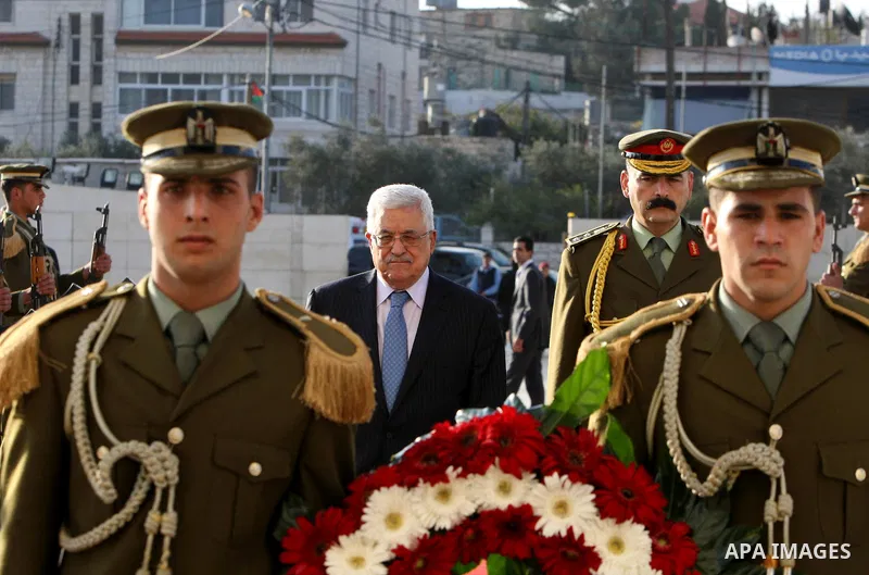 Palestinian President Mahmoud Abbas lays a wreath on the tomb of Yasser Arafat, PLO chairman and former Palestinian president, in the West Bank town of Ramallah on 6,2011 marking the Eid al-Adha holiday, celebrated at th...
