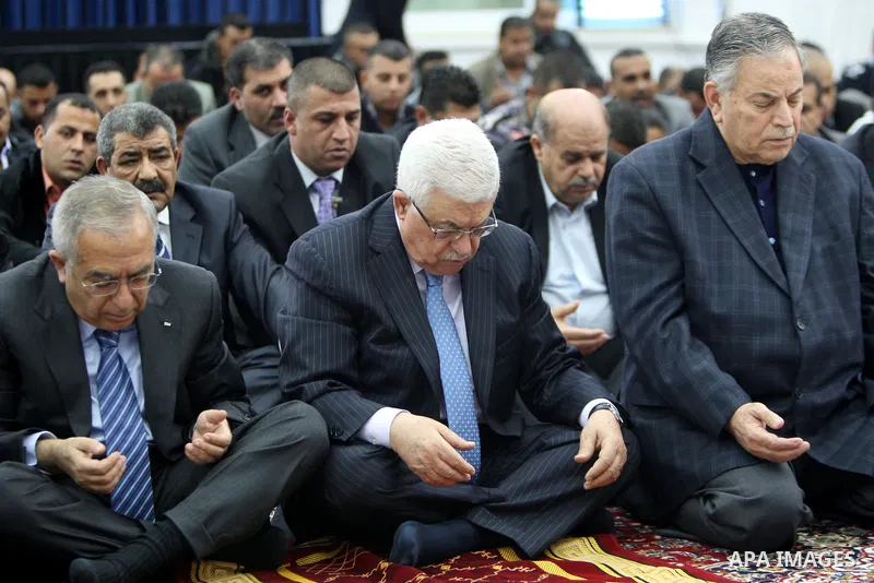 Palestinian President Mahmoud Abbas attends Eid al-Adah prayers in the West Bank town of Ramallah on 6,2011 marking the Eid al-Adha holiday, celebrated at the end of the 'Hajj' pilgrimage to Mecca.. Photo by Thaer Ganaim
