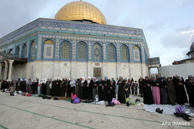 Palestinian women attend Friday prayers in front of the Dome of the Rock on the compound known to Muslims as al-Haram al-Sharif, and to Jews as Temple Mount, in Jerusalem's Old city, on the first day of Eid al-Adha Novem...