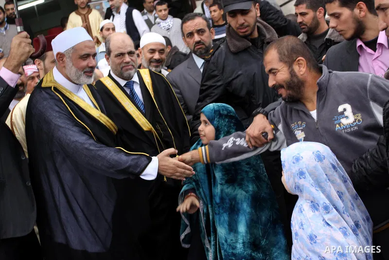 Palestinian prime minister in Gaza Strip, Ismail Haniya attends the prayers of Eid al-Adha celebrations in Gaza City, Sunday, Nov. 6, 2011. Muslims worldwide celebrate Eid al-Adha, or the Feast of the Sacrifice, by sacri...