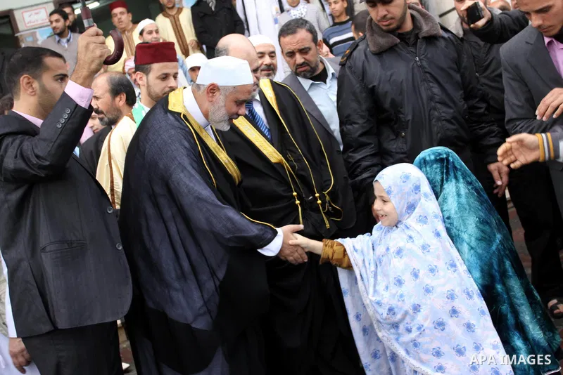 Palestinian prime minister in Gaza Strip, Ismail Haniya attends the prayers of Eid al-Adha celebrations in Gaza City, Sunday, Nov. 6, 2011. Muslims worldwide celebrate Eid al-Adha, or the Feast of the Sacrifice, by sacri...