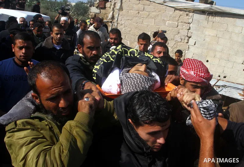 Palestinians mourn the body of Abdullah Mohana, Islamic Jihad militant, in Khan Younis, southern Gaza Strip, Sunday, Nov. 6, 2011. A Palestinian official said that one of Islamic Jihads militants was killed and several o...