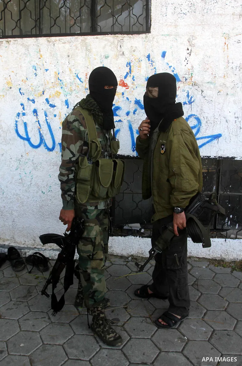 Palestinians mourn the body of Abdullah Mohana, Islamic Jihad militant, in Khan Younis, southern Gaza Strip, Sunday, Nov. 6, 2011. A Palestinian official said that one of Islamic Jihads militants was killed and several o...