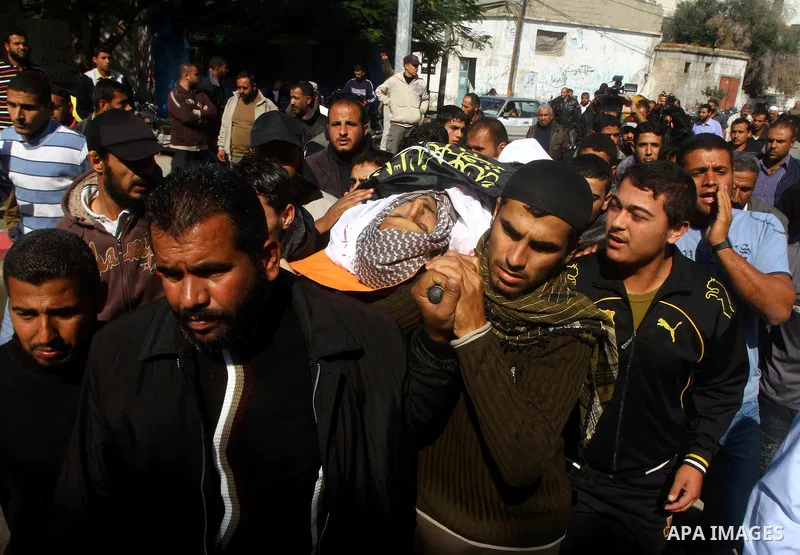 Palestinians mourn the body of Abdullah Mohana, Islamic Jihad militant, in Khan Younis, southern Gaza Strip, Sunday, Nov. 6, 2011. A Palestinian official said that one of Islamic Jihads militants was killed and several o...