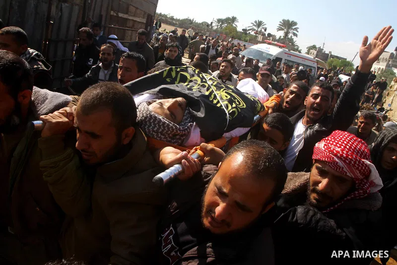 Palestinians mourn the body of Abdullah Mohana, Islamic Jihad militant, in Khan Younis, southern Gaza Strip, Sunday, Nov. 6, 2011. A Palestinian official said that one of Islamic Jihads militants was killed and several o...
