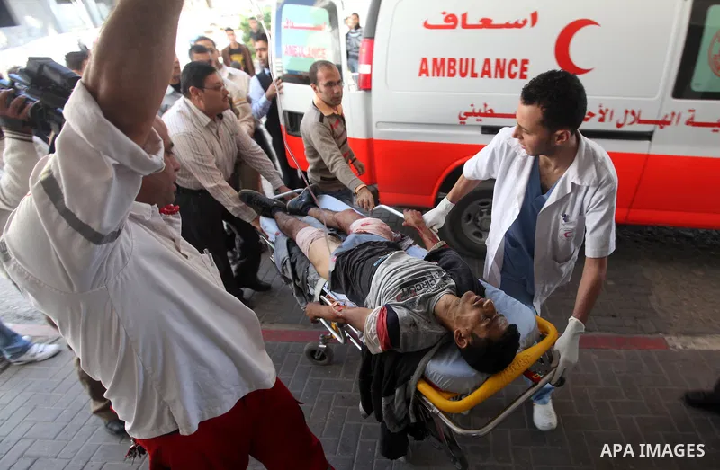 A Palestinian youth Transfering wounded at al Shifa hospital following an Israeli airstrike in Gaza City on Nov. 07, 2011. Muslims worldwide celebrate Eid al-Adha, or the Feast of the Sacrifice, by sacrificial killings o...