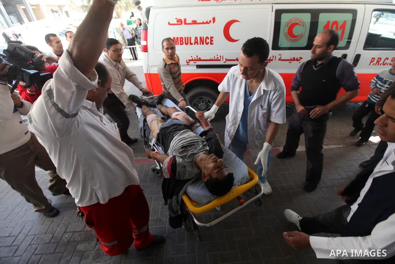 A Palestinian youth Transfering wounded at al Shifa hospital following an Israeli airstrike in Gaza City on Nov. 07, 2011. Muslims worldwide celebrate Eid al-Adha, or the Feast of the Sacrifice, by sacrificial killings o...