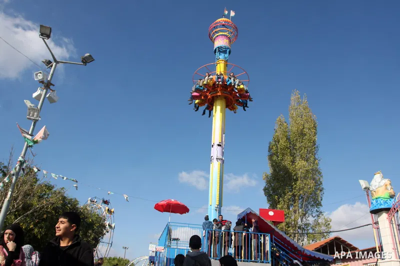 Palestinians enjoy riding at an amusement park during the second day of Eid al-Adha in the West Bank city of Ramallah on November 7, 2011. Muslims worldwide commemorate the Eid al-Adha, or the Feast of the Sacrifice, mar...