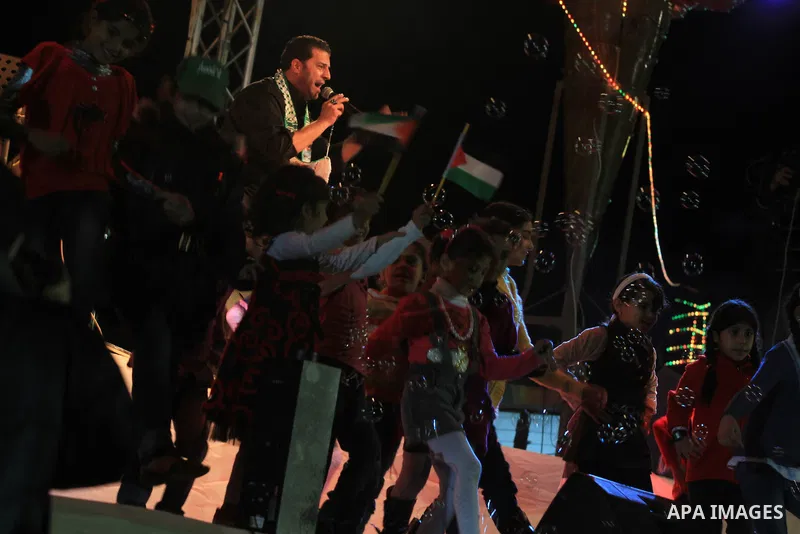 A religious eulogy band perform during islamic celebration of the upcoming Eid al-Adha fetival in Khan Younis, southern Gaza Strip on November 8, 2011. Photo by Majdi Fathi