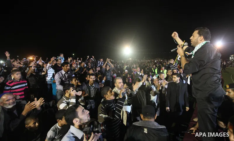 A religious eulogy band perform during islamic celebration of the upcoming Eid al-Adha fetival in Khan Younis, southern Gaza Strip on November 8, 2011. Photo by Majdi Fathi