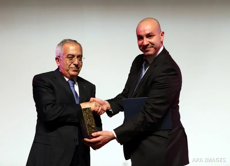 Palestinian prime minister Salam Fayyad attends a celebration to mark the seventh anniversary of the death of late Palestinian leader Yasser Arafat in the West Bank city of Ramallah on November 11, 2011. Photo by Mustafa...