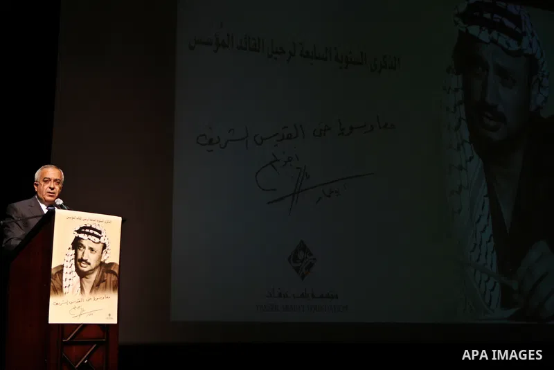 Palestinian prime minister Salam Fayyad attends a celebration to mark the seventh anniversary of the death of late Palestinian leader Yasser Arafat in the West Bank city of Ramallah on November 11, 2011. Photo by Mustafa...