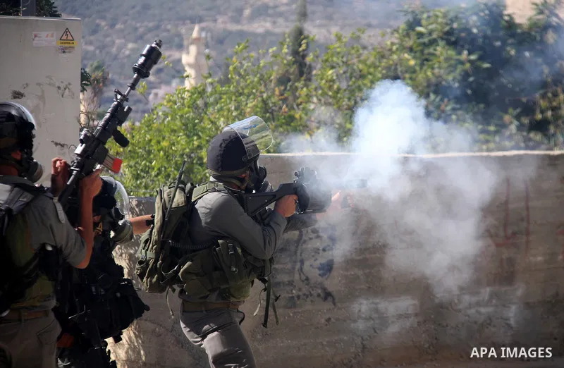 Israeli forces clash with Palestinian protestors during a weekly demonstration against Israeli-occupation in the northern West Bank village of Kfar Kadum, on November 11, 2011. The Palestinian leadership is unsure how to...