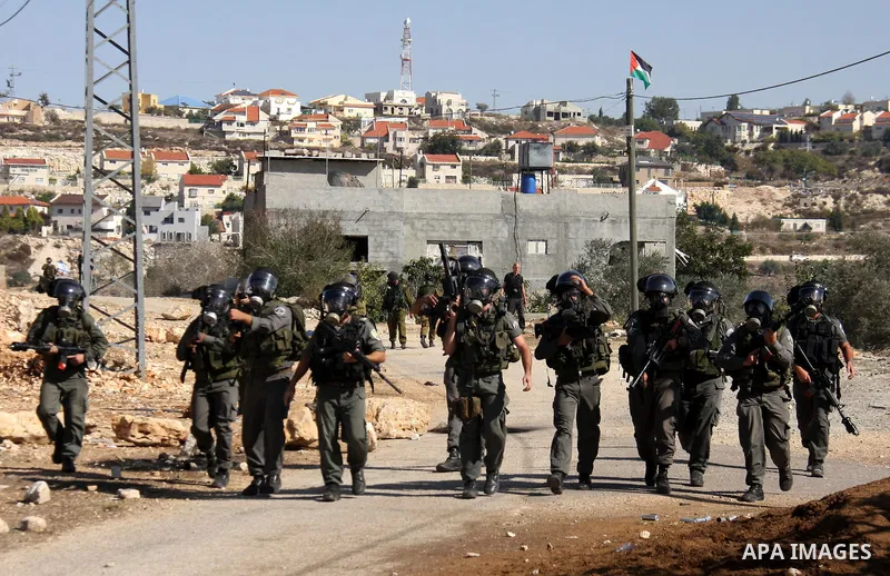 Israeli forces clash with Palestinian protestors during a weekly demonstration against Israeli-occupation in the northern West Bank village of Kfar Kadum, on November 11, 2011. The Palestinian leadership is unsure how to...