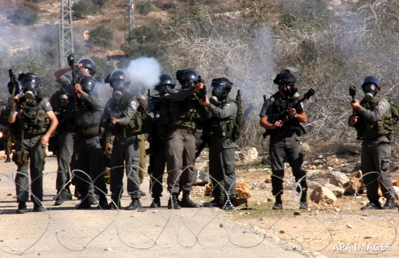 Israeli forces clash with Palestinian protestors during a weekly demonstration against Israeli-occupation in the northern West Bank village of Kfar Kadum, on November 11, 2011. The Palestinian leadership is unsure how to...