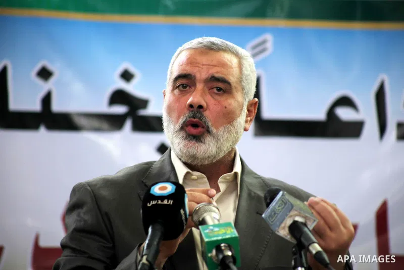 Palestinian prime minister in Gaza Strip, Ismail Haniya mourns the body of Mohammed al-Najjar, one of the founders of Muslims brotherhood in Palestine and Hamas movement leader, in the southern Gaza Strip town of Khan Yo...