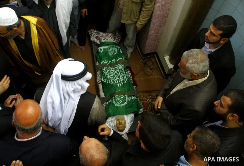 Palestinian prime minister in Gaza Strip, Ismail Haniya mourns the body of Mohammed al-Najjar, one of the founders of Muslims brotherhood in Palestine and Hamas movement leader, in the southern Gaza Strip town of Khan Yo...