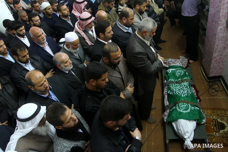Palestinian mourn the body of Mohammed al-Najjar, one of the founders of Muslims brotherhood in Palestine and Hamas movement leader, in the southern Gaza Strip town of Khan Younis on Nov. 11,2011 . Photo by Ashraf Amra