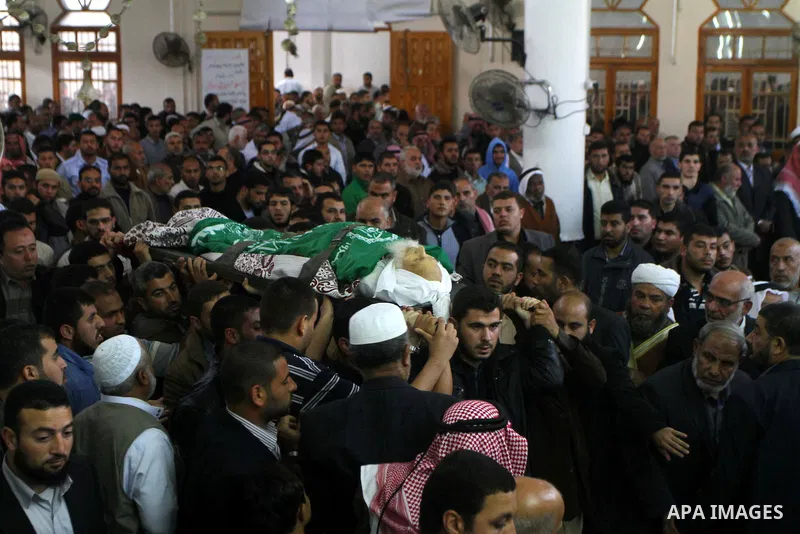 Palestinian mourn the body of Mohammed al-Najjar, one of the founders of Muslims brotherhood in Palestine and Hamas movement leader, in the southern Gaza Strip town of Khan Younis on Nov. 11,2011 . Photo by Ashraf Amra