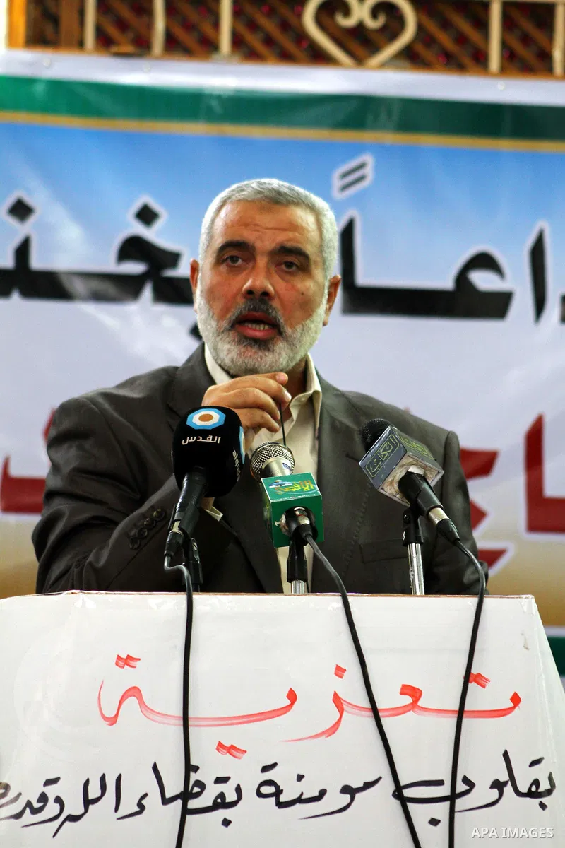 Palestinian prime minister in Gaza Strip, Ismail Haniya mourns the body of Mohammed al-Najjar, one of the founders of Muslims brotherhood in Palestine and Hamas movement leader, in the southern Gaza Strip town of Khan Yo...