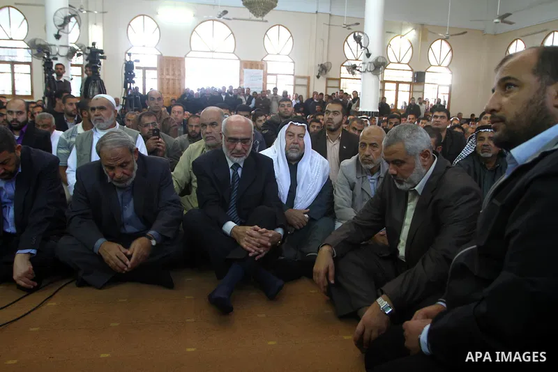 Palestinian prime minister in Gaza Strip, Ismail Haniya mourns the body of Mohammed al-Najjar, one of the founders of Muslims brotherhood in Palestine and Hamas movement leader, in the southern Gaza Strip town of Khan Yo...