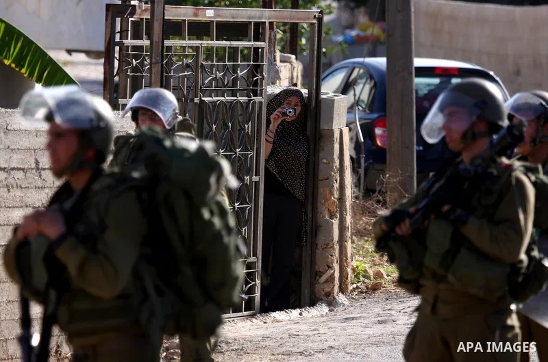 Israeli soldiers take positions during clashes between Israeli security forces and Palestinian demonstrators at a weekly protest in the West Bank village of Nabi Saleh, near Ramallah November 11, 2011.. Photo by Issam Ri...